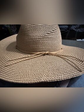 This is a Magid Straw Tie Crown Floppy Hat in tan